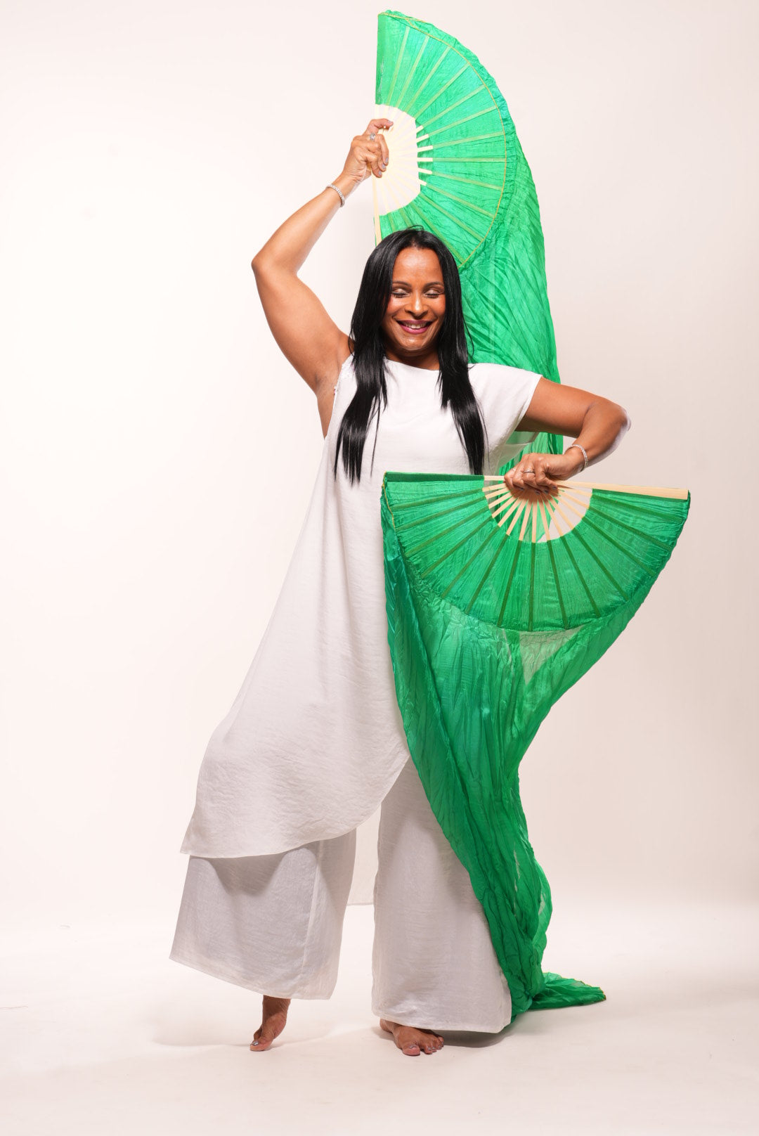 White silk cape with sequin decor on shoulder