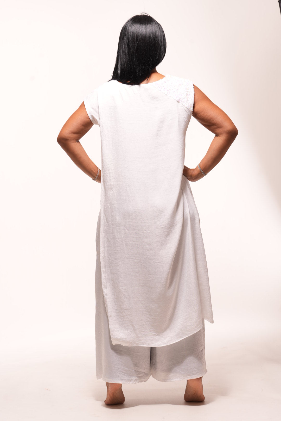 White silk cape with sequin decor on shoulder